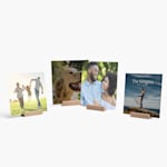 A group of square-shaped tabletop prints, each featuring different photos. 