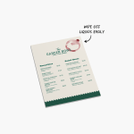 A water-resistant Foamex menu card, undamaged by a small spill, with a note that you can wipe off liquids easily.