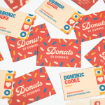 Designs for the front and back of several triple layer business cards for a doughnut shop.