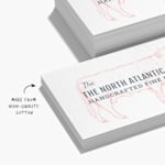 Business cards for a fine-dining restaurant with a note that they’re made from high-quality cotton.