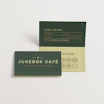 Folded business cards designed for a coffee shop, also functioning as loyalty cards, are shown in both interior and exterior views.