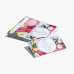 A stack of folded business cards for a florist’s shop.