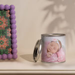 A personalised photo candle customised with a picture of a baby girl and the year, ‘2025’.