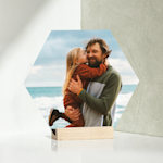 A hexagon-shaped tabletop print featuring a father and his daughter. 