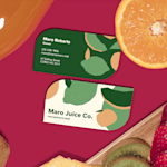 Leaf shaped business cards promoting a beverage business, with an illustrated logo on the back.