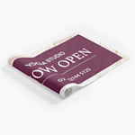 A fabric poster promoting a yoga studio, partially unrolled.