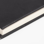 A close up shot of the faux leather cover texture.