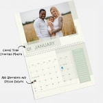A personalized wall calendar open to a photo of two parents and their baby, with a note that you can choose the starting month of your calendar and also add birthdays and special events.