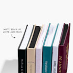 Guest book spines customized for various occasions, including a bridal shower and anniversary party.