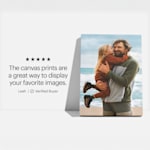 Two photo canvas prints hanging on the wall, one of them showing two kids, the other one is a dog photo