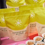 An image of stand up-pouches featuring lemon lime granola superfood blend.