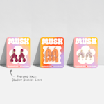 3 similarly designed postcards being used as jewelry backing cards.