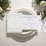 One vertical letterpress RSVP and one horizontal letterpress RSVP with various decorative details.