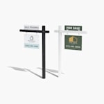 A black colonial post with a sale pending rider and real estate yard sign next to a white colonial post with a for sale rider and real estate yard sign.