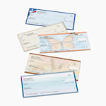 An assortment of personal wallet checks in various colors and designs, stacked in an overlapping arrangement.