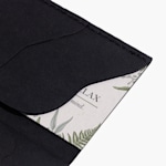 A black Kraft business card holder with a card inside.