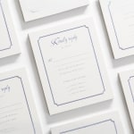 A letterpress RSVP card featuring cursive script.