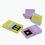 4 slide-open boxes for a jewelry brand. 2 are closed, 1 is open and displaying earrings and 1 is open and displaying a necklace.