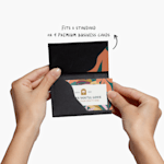 A person holding a black Kraft business card holder.