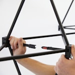 An up close of .locking the clips of the pop-up display together,