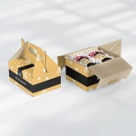2 cajas loncheras personalizadas, amarillo y negro. 1 caja con miel en frasco adentro.
