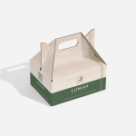 Una caja lonchera personalizada color verde y crema.