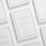 Una invitación de boda letterpress con un tipo de letra clásico y un borde elegante.