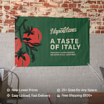 A vinyl banner hanging on a wall promoting an Italian restaurant. Highlighted benefits include new lower prices, easy upload, 25+ sizes and fast, free shipping.