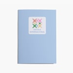 Caderno azul-claro com autocolante do logótipo United School na capa.