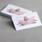 A stack of soft touch business cards featuring a photo studio.